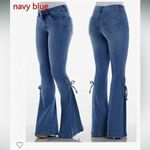 None Lightweight Women’s blue jeans, flared leg with tie details, size large Photo 1