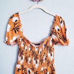 Olivaceous  Orange Floral Off Shoulder Smocked Romper Photo 2