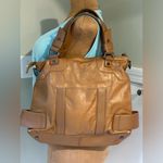 wilson's leather Wilson Leather Dark tan. Soft leather. Has Extra crossbody strap to side… Photo 1
