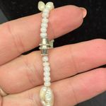 Three Strand Freshwater Pearl Necklace Hand Photo 3