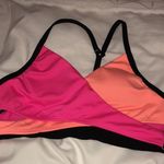 PINK - Victoria's Secret PINK Sport swim suit bikini top orange and pink in color size small spor…​ Photo 3