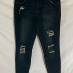 Tractr: Stretchy Skinny Jeans with red flannel covered holes Photo 0
