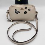 Coach CROSSBODY POUCH WITH SOUVENIR
EMBROIDERY ( F25946)
CHALK/LIGHT GOLD Photo 0