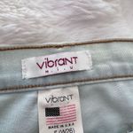 Vibrant Ripped Bell Bottom Jeans Photo 1