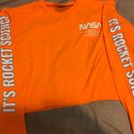 Rue 21 Orange Nasa Crop Top Photo 0