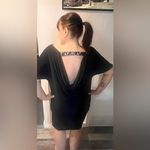 Black cocktail dress. Practically new. Jewel detail, draping back! Marina brand Size 16 Photo 1
