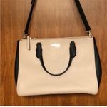 Kate Spade Cream and Black Large Leather Satchel Handbag with Crossbody Strap. Photo 1