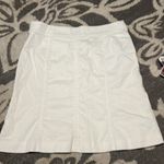 Lilly Pulitzer Lily Pulitzer white skirt. Size 8 has cheetah print buttons on front. Like new. Photo 3