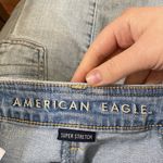 American Eagle  button through high rise light wash mini denim skirt size 00 Photo 6