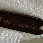 Free People Cream Blouse with Ruffled Asymmetrical Design and Short Sleeves Photo 3