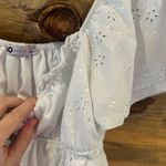 SO  Eyelet Flutter Smocked Top Photo 3