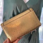 Guess  Gold Clutch with Floral Accents Photo 1