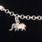 Sterling silver and peridot lucky charm bracelet. Photo 1