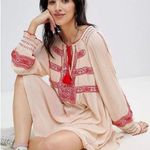 Free People • Wind Willow embroidered mini dress peasant smocked tassel cream Photo 0