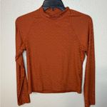 Nike Icon Clash all over logo print mock-neck long sleeve top in terracota Photo 1