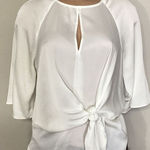 Vince Camuto New. ivory blouse bar top. Retails $89. Size XS. runs a little big. Photo 0