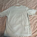 Adika Down to Earth Graphic T-Shirt Photo 1