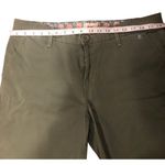 Levi's Levi’s olive green flat-front chino shorts. Button and zip fly closure, belt loo Photo 4