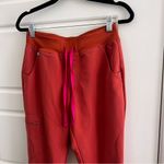 FIGS  Orange and Pink Jogger Pants Photo 1