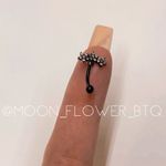 Black Triple Flower CZ Cartilage Earring Photo 4