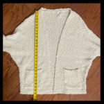 Umgee Cream SHERPA Cardigan - size Medium. Gently warn and excellent condition. No buttons, and pockets in front. Butterfly shaped. Measurements approximately 28” from armpit to armpit x 27” long. None smoking home. Priced at as is condition. Don’t like my price make a reasonable offer! And thank you for checking my closet! Photo 7