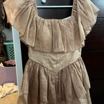 sunkissed Gold/tan ruffle romper Photo 1