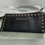 Michael Kors  Womens Saffiano Leather Stud Long Zip Clutch with gold tone studs. Photo 1