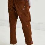 Urban Outfitters  Corduroy pull on pants with embroidered flowers size L Photo 1