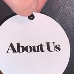 About Us 🎓 NWT  Silver Metallic Mini Dress with Ruffle Photo 5