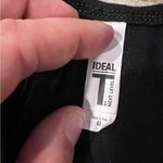 Next Level Women’s Ideal T by  Black Medium Down to Fiesta Razorback Tank Top Photo 2