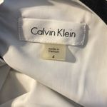 Calvin Klein black cut out dress with white lining. NWT. Photo 7