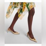 Dolce & Gabbana
Logo-embellished raffia slingback pumps Photo 4