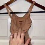 SKIMS SCULPTING BODYSUIT WITH SNAPS in Ochre S/M Photo 1