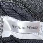 Studio Works  black swimsuit with pretty tropical design up top. Skirted bottom. Photo 5