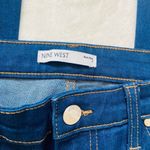 Nine West mid rise dark wash kick flare jeans with frayed bottom pant legs Photo 1