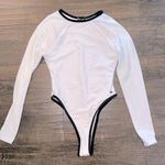 NWOT Long Sleeve Open Back One Piece Photo 0