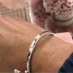 Kate Spade  Silver Bow Bangle NWT Photo 1