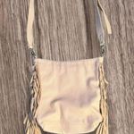 Expressions NYC Vegan Leather w/ Suede Fringe Crossbody Bag in Cream. Photo 0