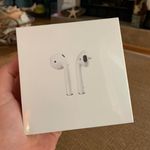 Apple AirPods with Charging Case Photo 0