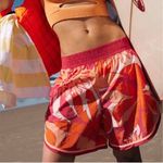 Free People NEW FP Movement The Long Shot Printed Shorts Firey Combo Pink Orange Photo 1