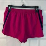 Nike dri-fit magenta lined running shorts size medium Photo 3