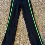 Lululemon Athletics Crops Black Leggings with green stripe Size 2 excellent cond Photo 1