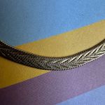 Gold tone flat herringbone bracelet Photo 4
