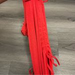 Out from under red bodysuit XS Photo 8