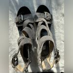 Michael Kors MK gladiator sandals in grey, with crossed straps and silver buckle details. Photo 4