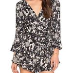 Free People All the Right Ruffles Romper in Raven Combo Button Back 3/4 … Photo 2