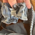 American Eagle NWT denim romper with cutout back and ruffle sleeves size S Photo 1