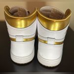 Nike White and Metallic Gold Air Jordan 1 Retro Sneakers Photo 6