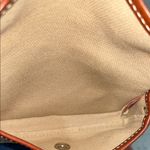 Dooney & Bourke  Cream and Brown Clutch with Vintage-Inspired Design Photo 2