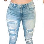 American Eagle  360 Next Level Stretch 4 Ripped patched light blue skinny jeans​​ Photo 0